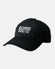 The Long Way Shops Long Way Up Black Cap features white embroidered LONG way up text on the front and is shown against a plain white background.