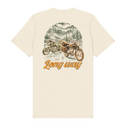 The Long Way Shop’s Long Way Bike Mountain Natural T-Shirt is a cream-colored unisex tailored fit tee crafted from soft Airlume combed cotton. It features a high-quality DTG-printed illustrated design of two motorcycles on a mountain road lined with pine trees, with “Long way” written in orange script beneath the image, offering lasting comfort and vibrant detail.