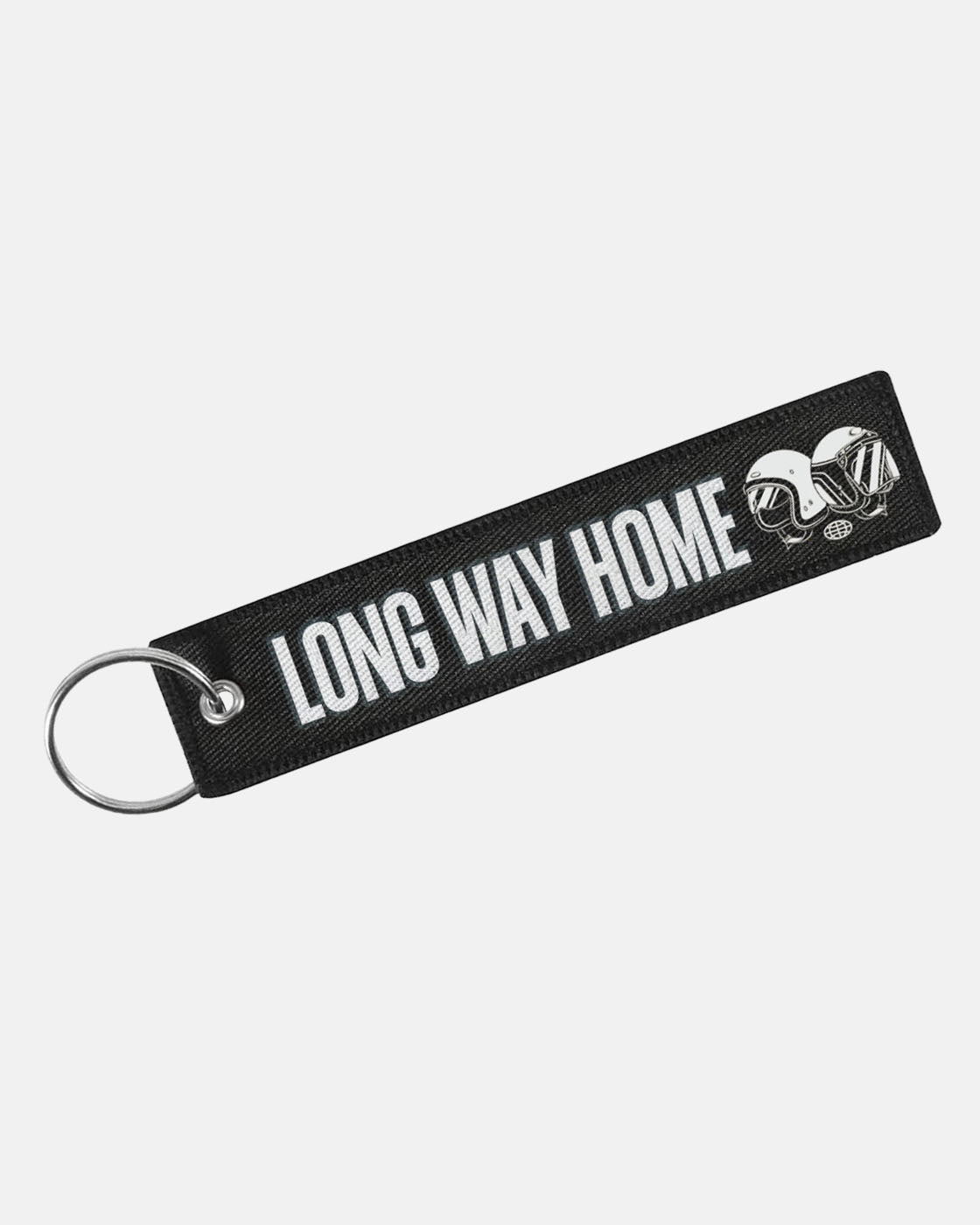 The Long Way Shop Keyring is a black fabric keychain with a silver ring, white LONG WAY HOME text, and two illustrated motorcycle helmets on the right.