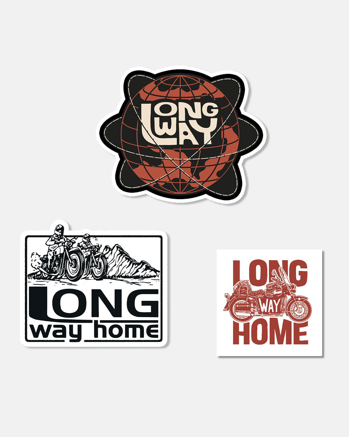 The Long Way Shop Sticker Set (set of 3) features a stylized globe with LONG WAY, two riders on motorcycles with LONG way home, and a motorcycle with bold red LONG WAY HOME.